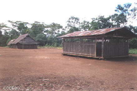 View to the old school, communal house and dining hall now with electric light with photovoltaic energy